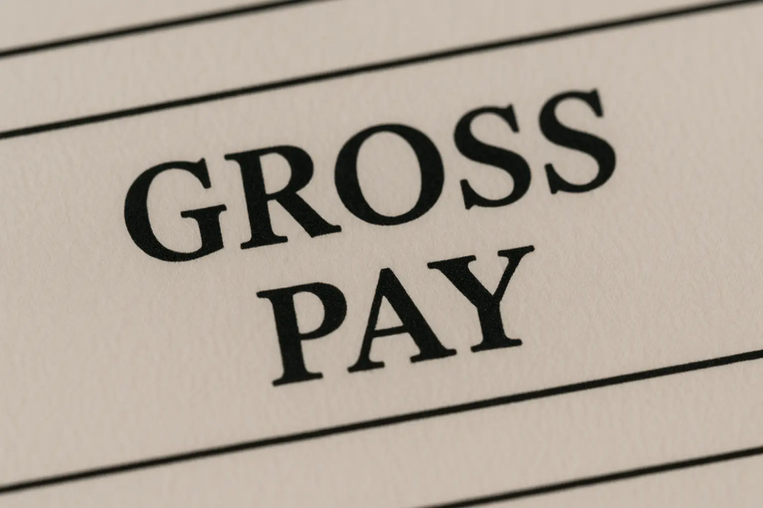 A close-up view of the words "GROSS PAY" on a document.